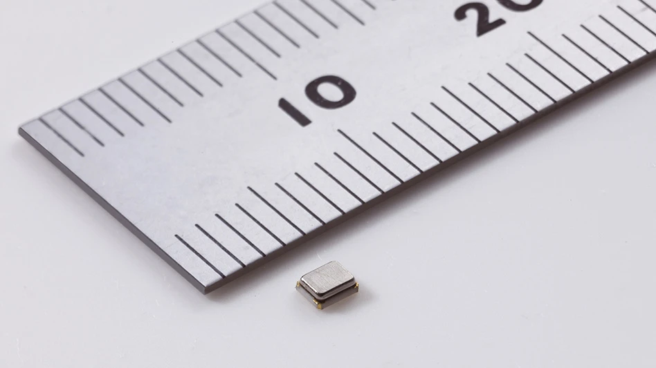 A ruler next to a small component