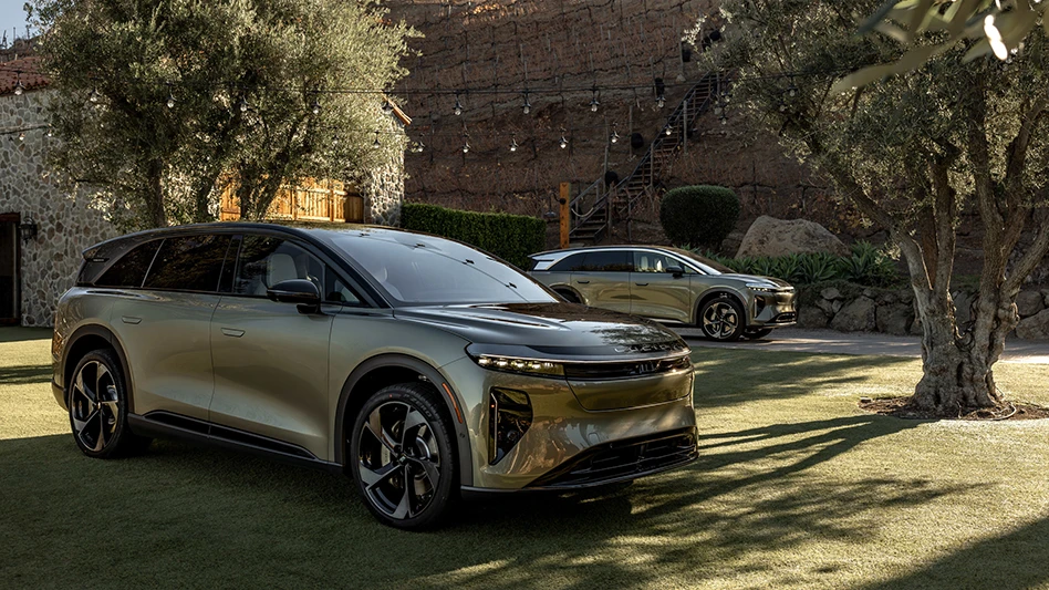 Two SUVs in a grassy area